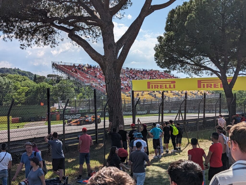 GA area near Acque Minerali exit as a McLaren driver climbs the hill towards Gresini.