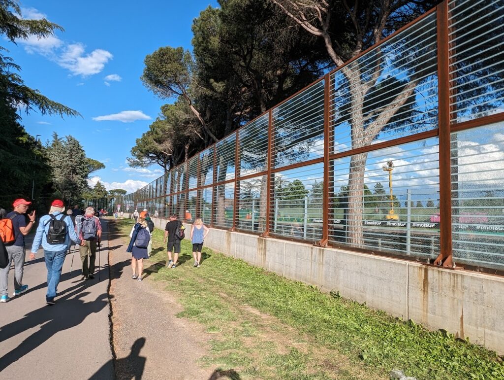 The GA area near the Gresini chicane exit has a large safety glass barrier that dampens the sounds and prevents flying debris towards houses on the opposite side of the service road.