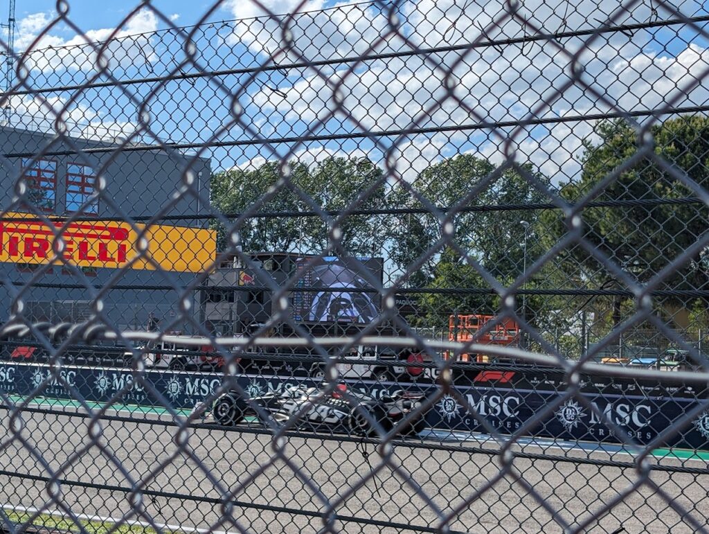 A Haas team driver enters pit lane in front of the Rivazza 1 grandstands as viewed from the GA area.