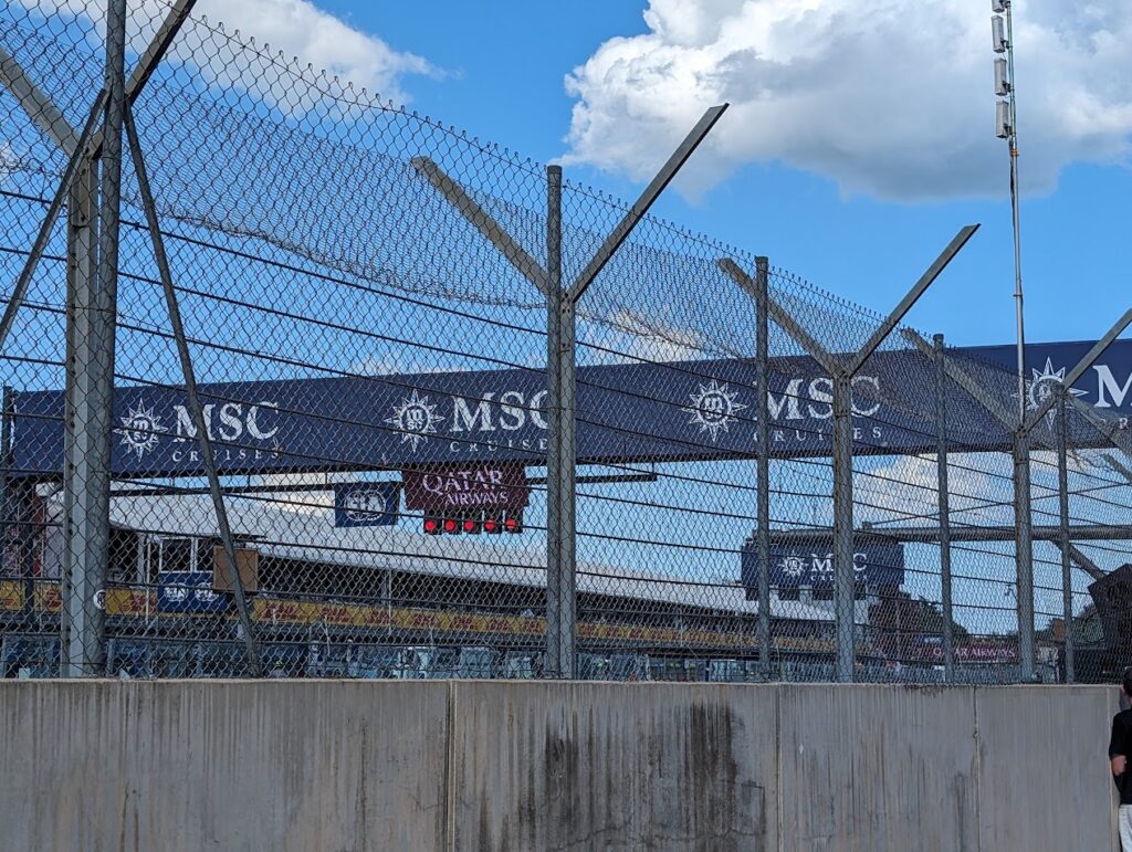 GA view near the start/finish line. The high concrete safety barrier limits the view substantially.