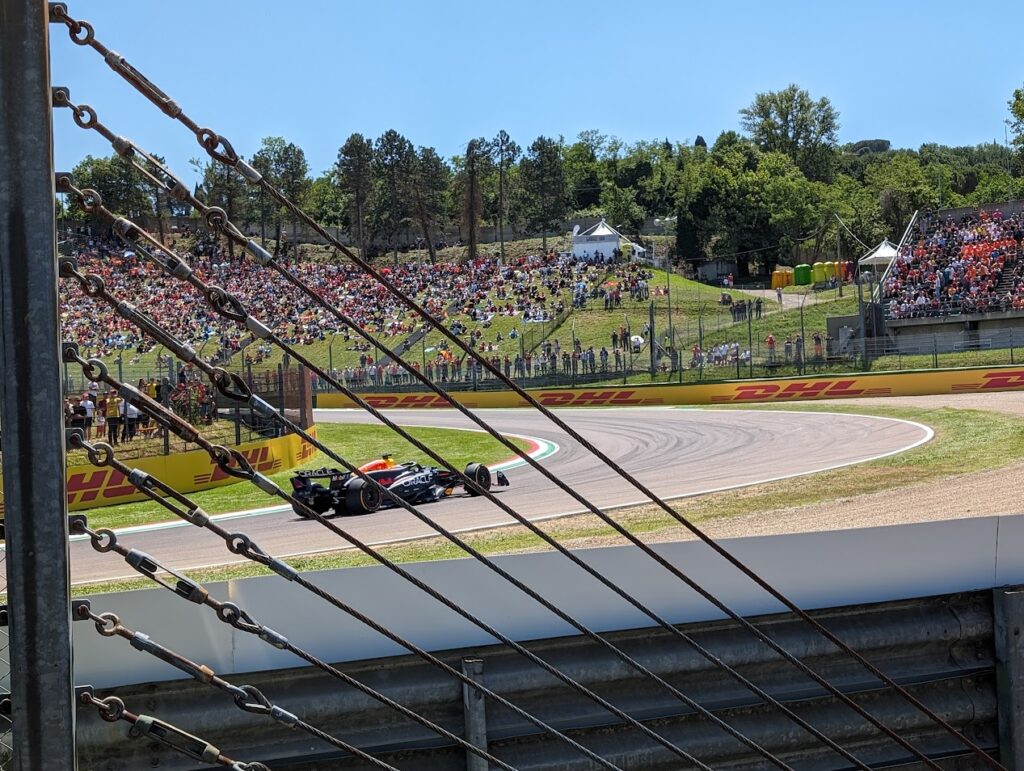 View of Prato Tosa from the GA area on the entrance to Tosa corner with a Red Bull driver turning in.