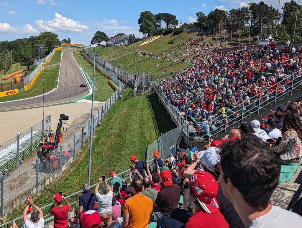 View of Prato Tosa from the Tosa grandstands (grassy hillside centered at the top).