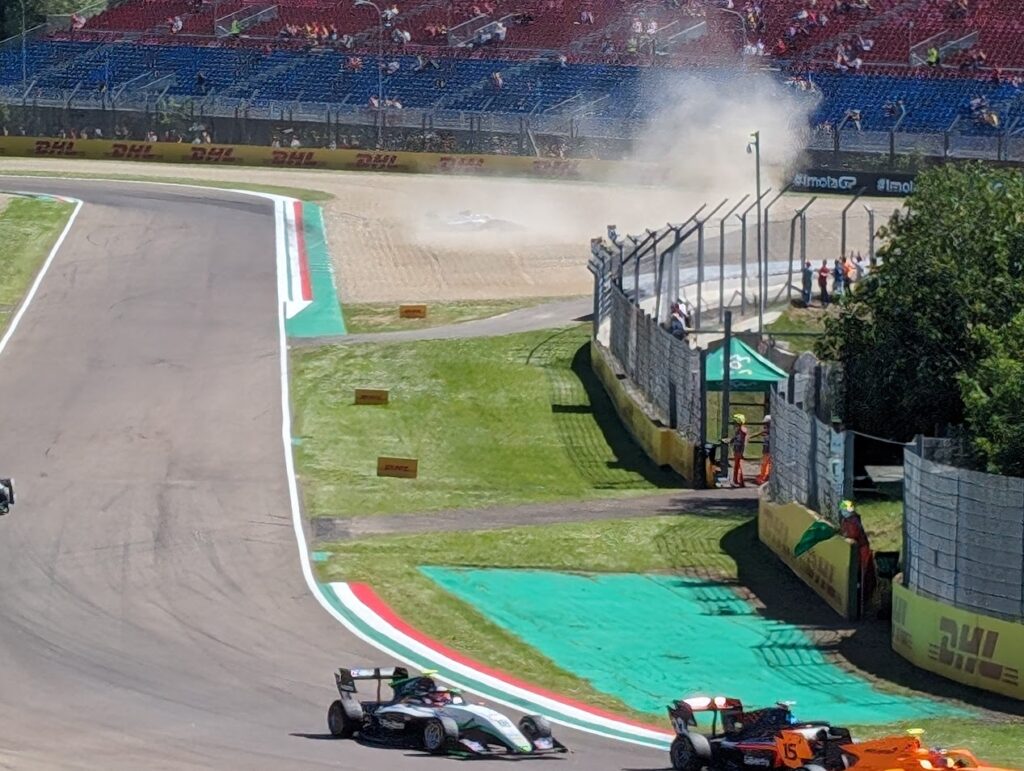 An F2 driver has beached it on the exit of the Villeneuve chicane (with help from another driver).