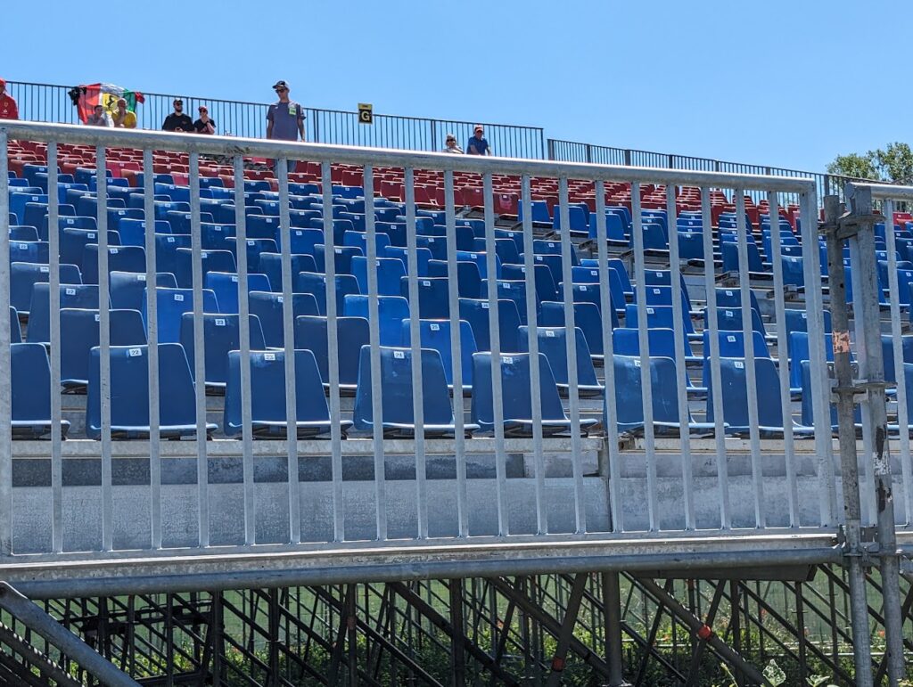 Closer view of the temporary Villeneuve grandstands which use stadium style seats with back supports.