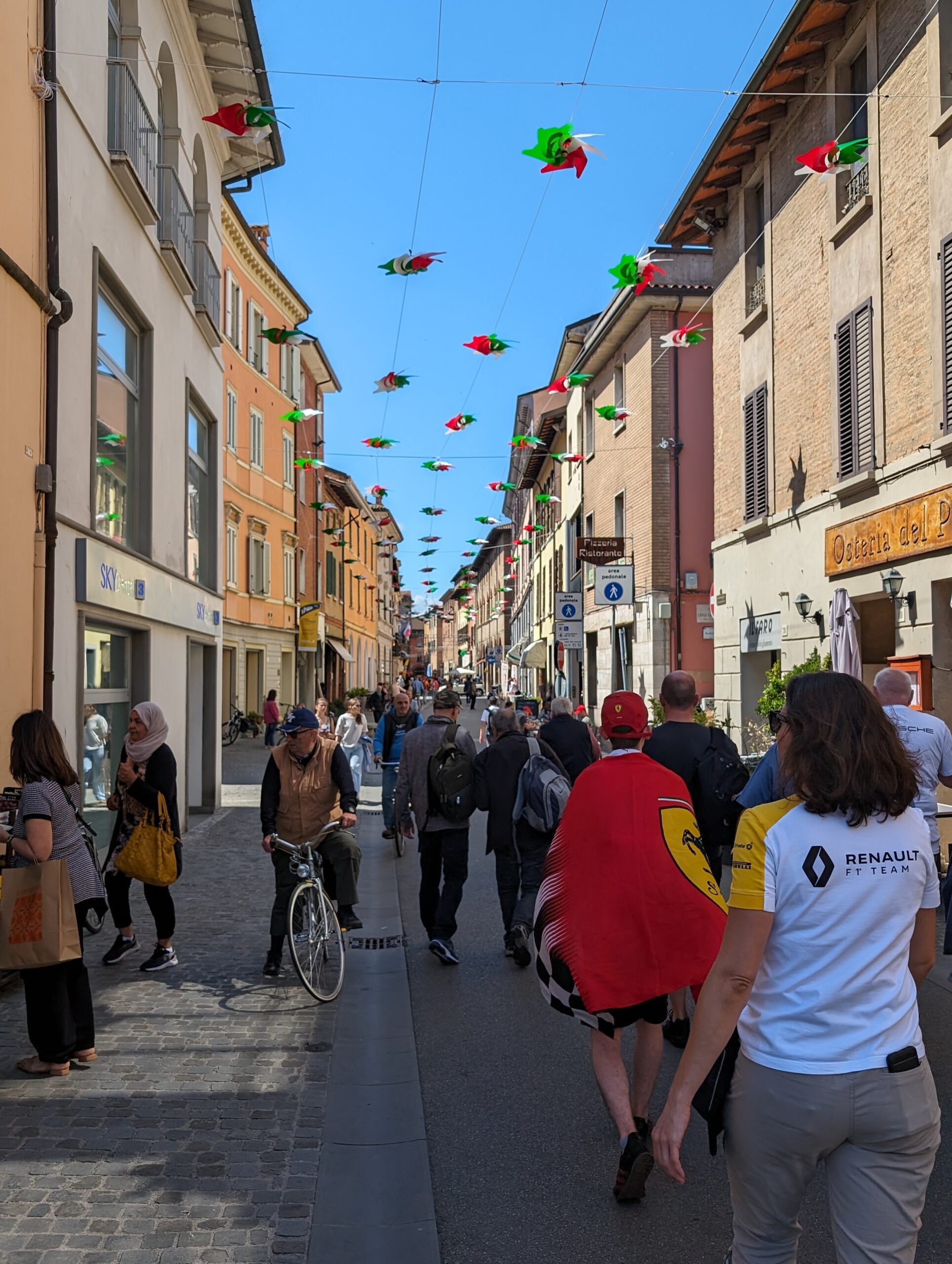 Busy street heading through Imola city center towards the circuit.