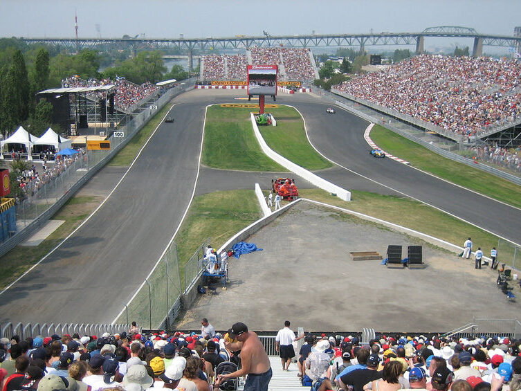 View of the tight hairpin corner in Montreal with grandstands on all sides.