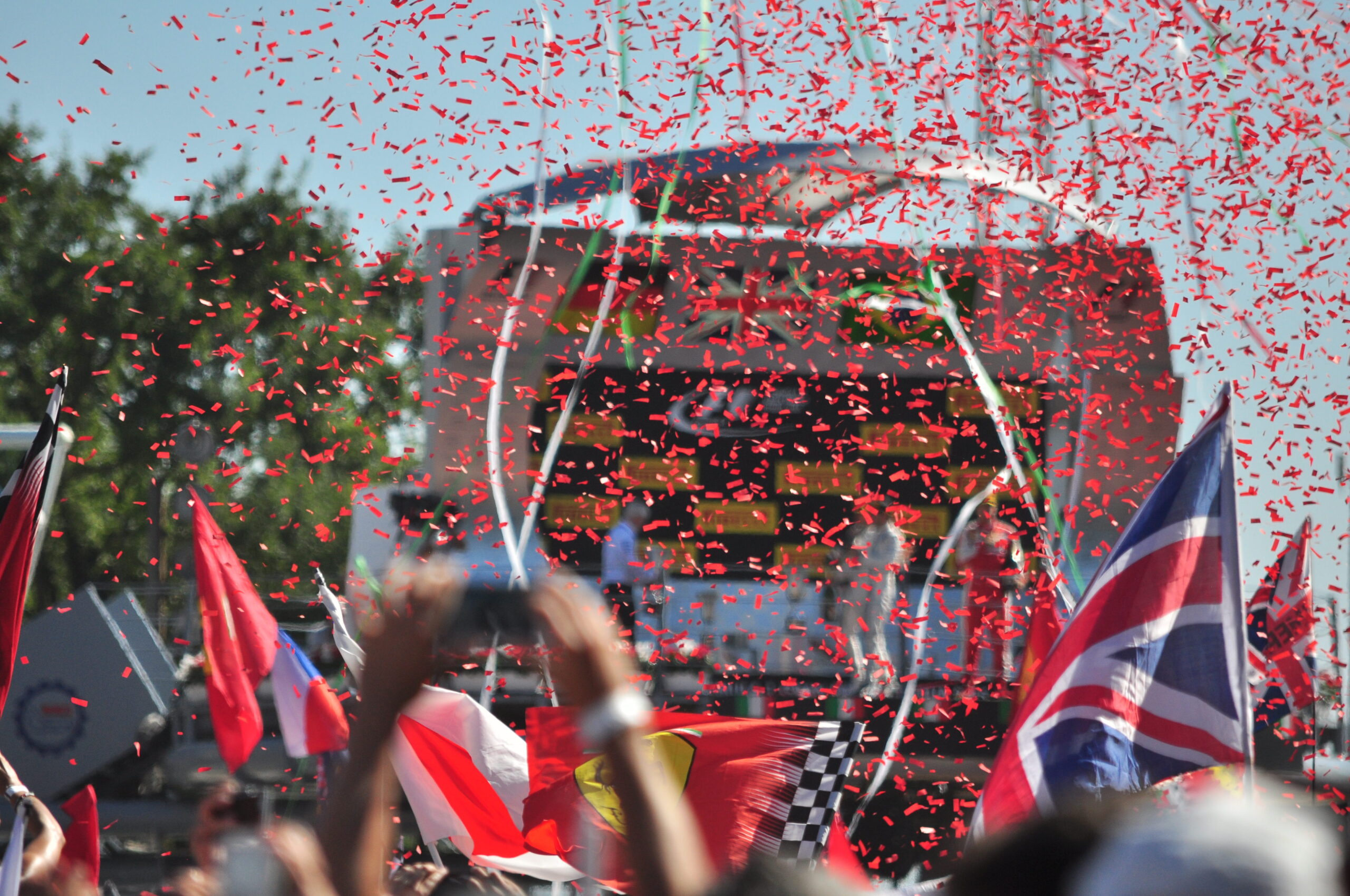 Podium celebration with confetti flying at Monza 2015.