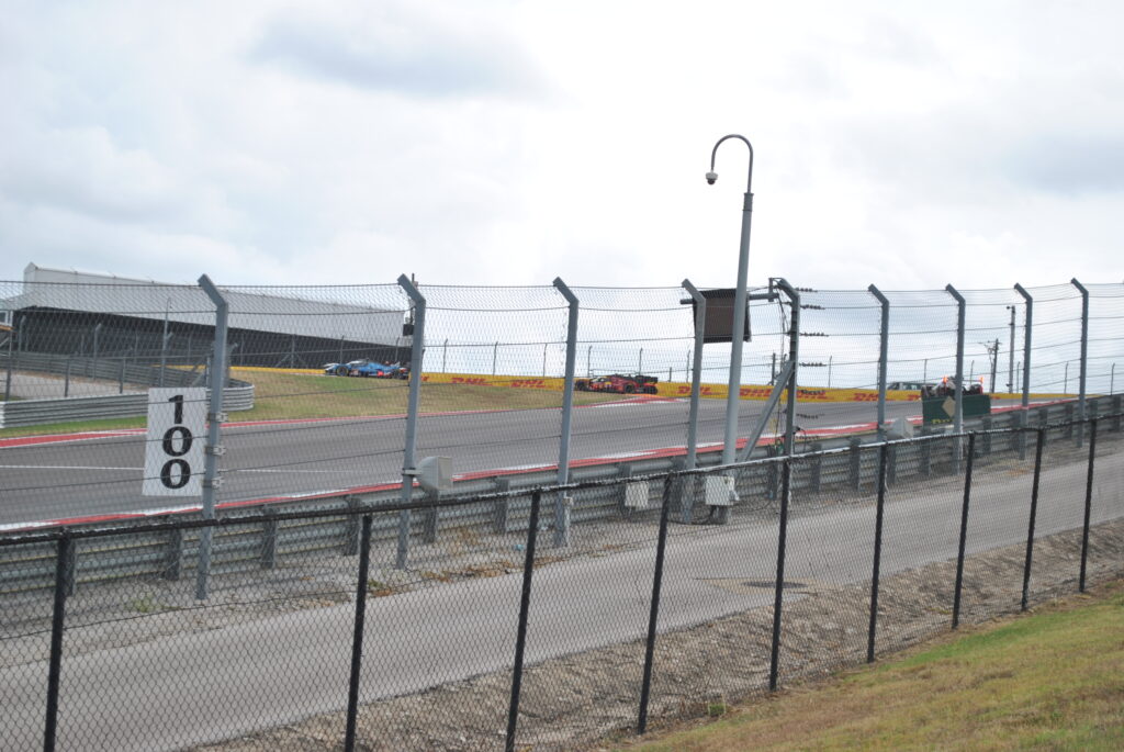 Hypercars taking T1 from the GA viewing area.