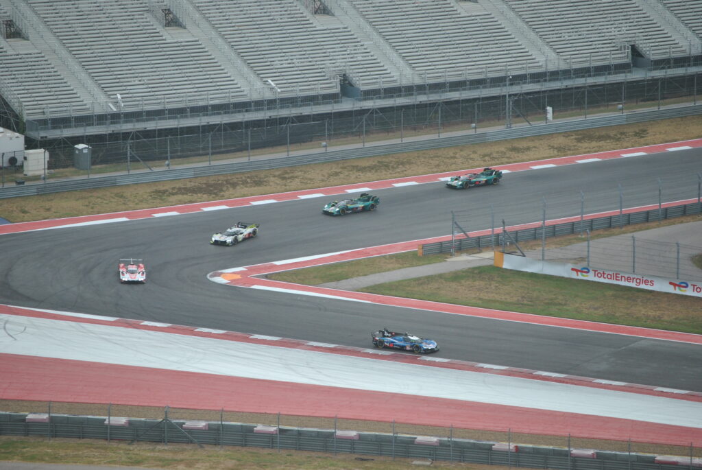 The Alpine Hypercar leads the rest out of T12 as viewed from the COTA Tower.
