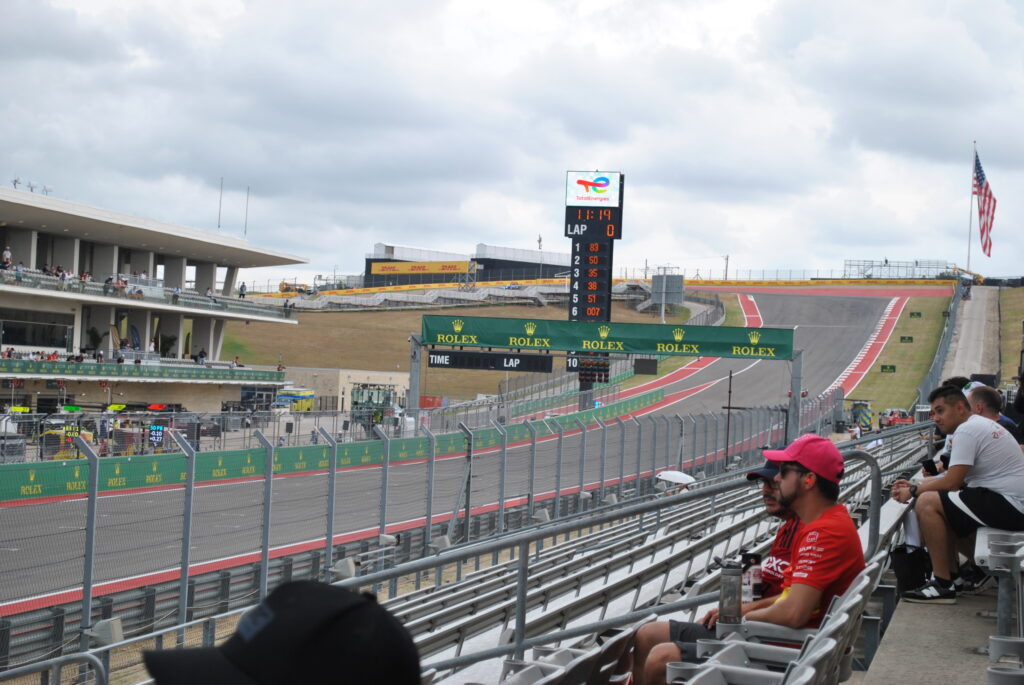 Lower grandstand view from the right side near the start-finish straight towards T1 - Big Red.