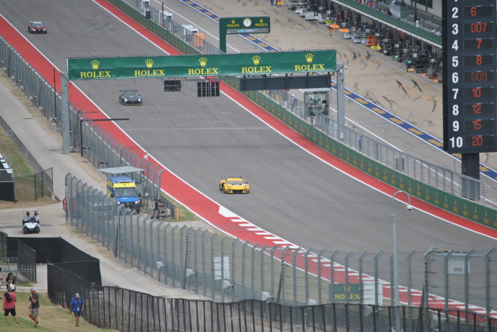 Zoomed in view of the start-finish straight from the left side of the T1 Grandstand.